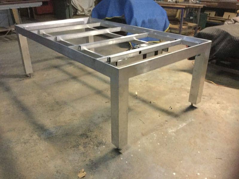 Metal entertainer pool table fram being built in the Quedos factory