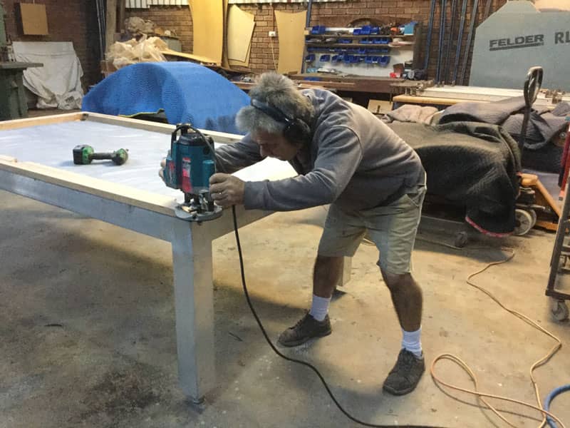Rob from Quedos working on an entertainer pool table for a Sydney based client