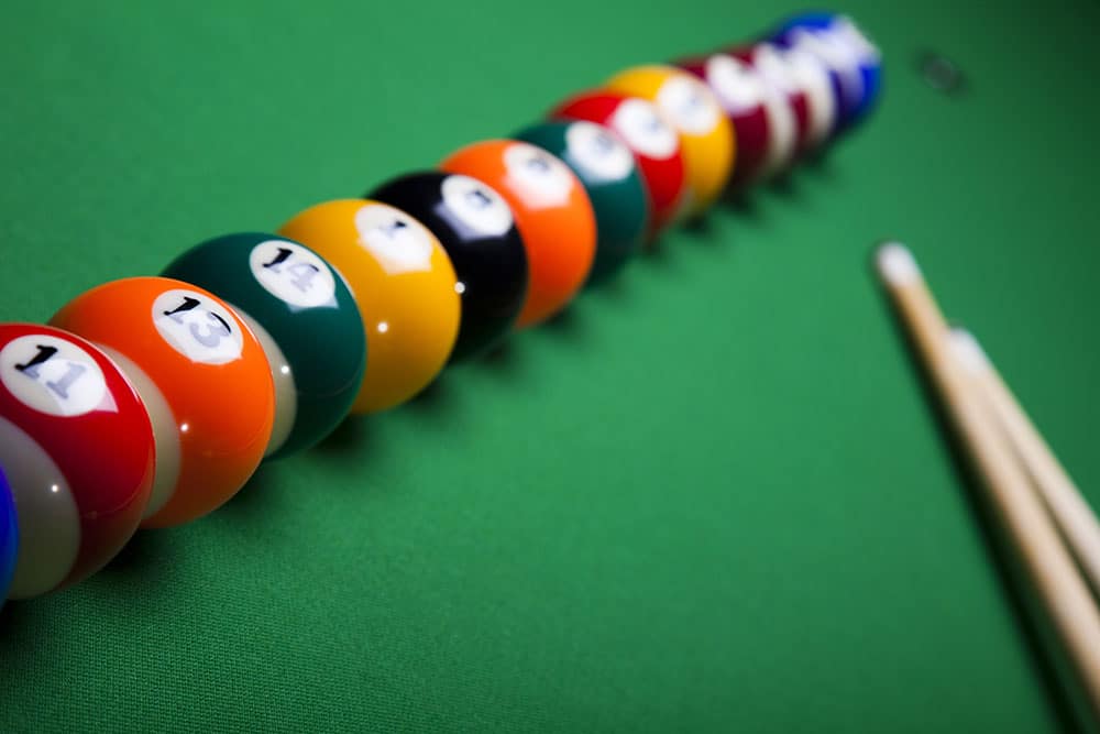 lined up pool balls on a table