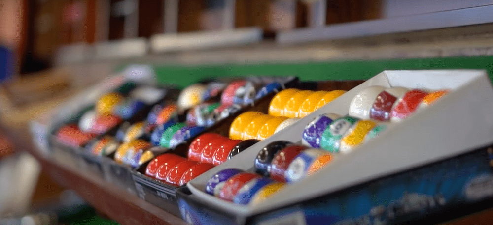 A selection of pool balls in the quedos showroom available for customers to choose from.