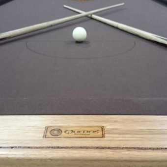 Brown felt on a rustic pool table created by Quedos.