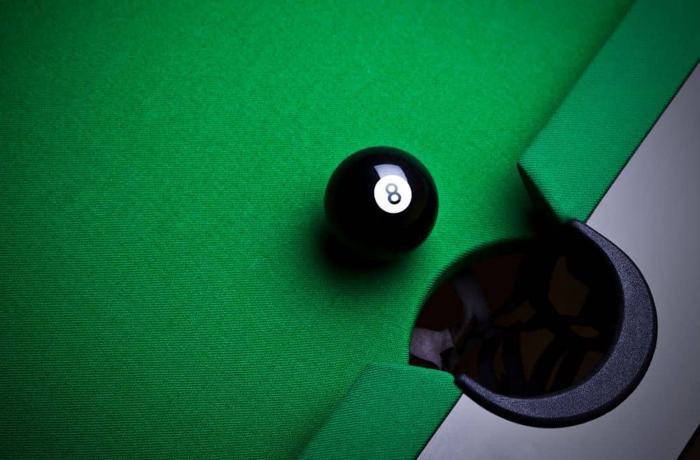 To win the pool game, you will need to pocket the number 8 ball after you have pocketed all seven balls.