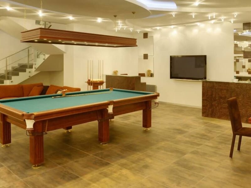 A billiards table is a timeless addition to any game room that is sure to provide hours of entertainment and fun.